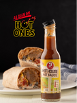 Bottle of Hot ouse Hot Sauce with a burrito on a plate, branded 'As Seen on Hot Ones'.