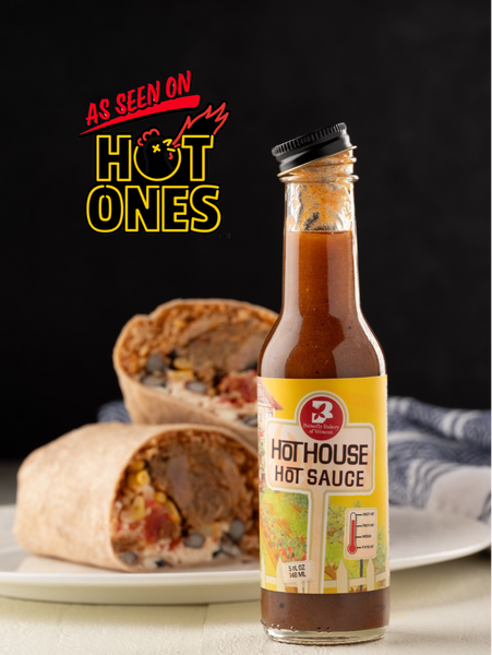 Bottle of Hot ouse Hot Sauce with a burrito on a plate, branded 'As Seen on Hot Ones'.